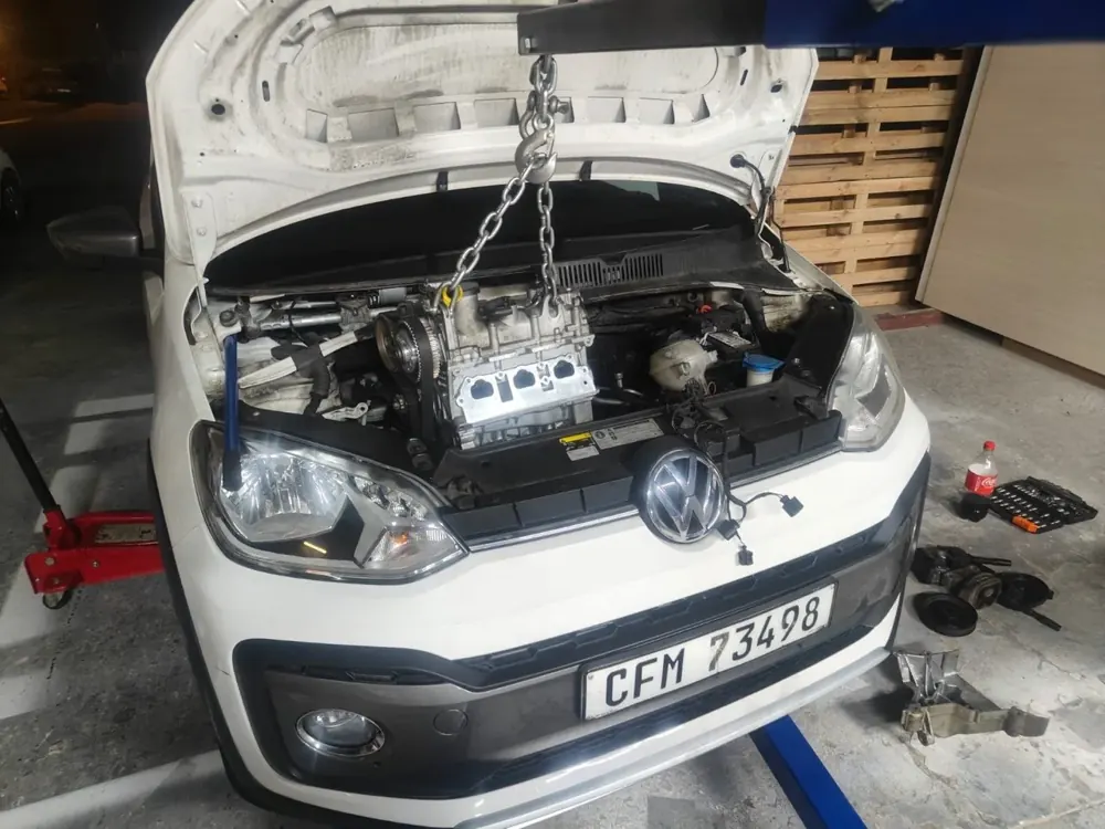 An engine lifted out on a hoist