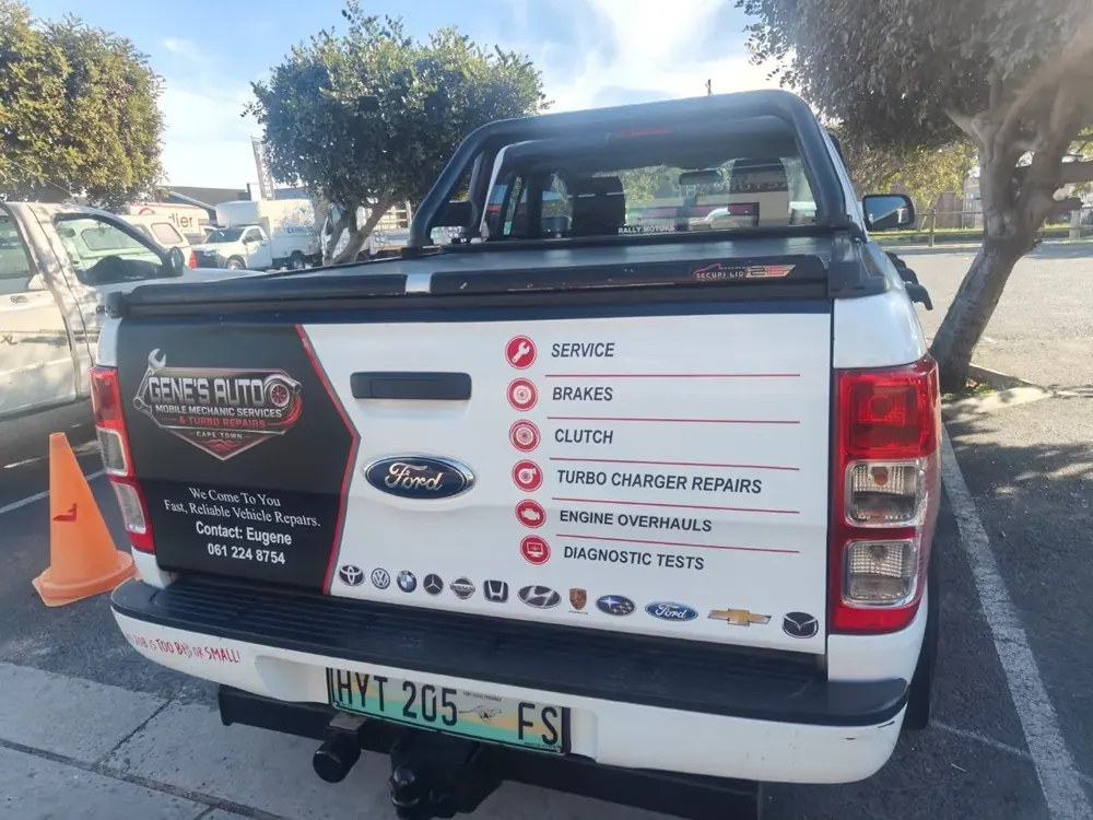 The Gene's Auto bakkie listing its services and vehicle marques