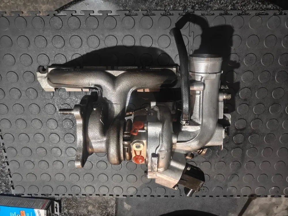 A turbocharger and exhaust manifold assembly